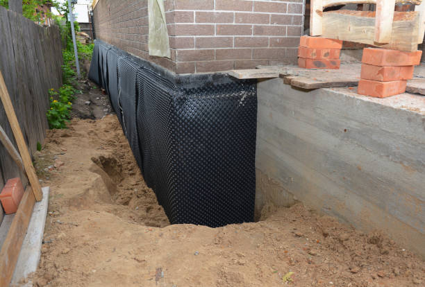 Happy homeowners after waterproofing job in Clarksboro